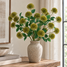 Green Fireball Spray styled in a stone vase
